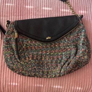 Juicy Couture Black and Gold Crossbody Bag with Crescent Shape